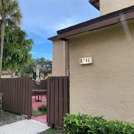 Rent this 2 bed townhouse on Cocoplum Circle in Coconut Creek, FL