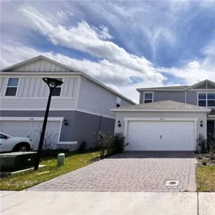 Rent this 4 bed house on Autumn Peace Drive in Kissimmee, FL 34769