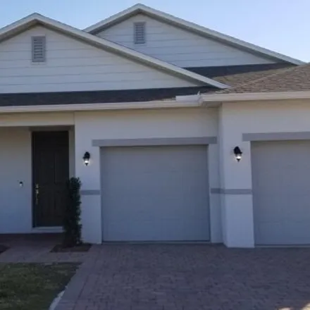 Rent this 4 bed house on 638 Southwest McCoy Avenue in Port Saint Lucie, FL 34953