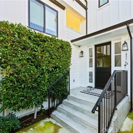 Rent this 3 bed condo on 411 in 411 1/2 Heliotrope Avenue, Newport Beach