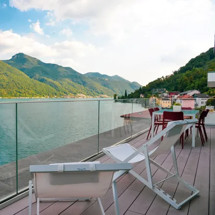 Rent this 3 bed apartment on Lungolago Giuseppe Motta 30 in 6815 Circolo di Carona, Switzerland
