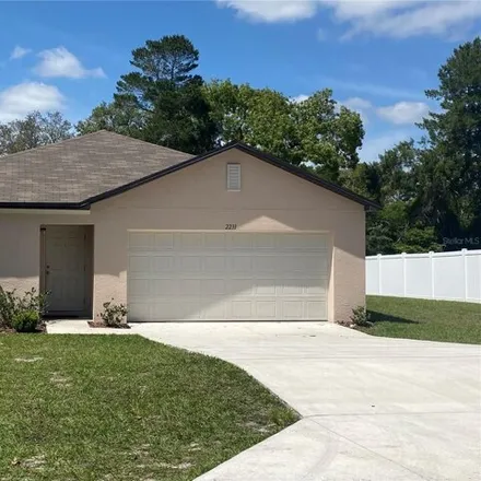 Rent this 3 bed house on 2223 Lake Forest Avenue in Spring Hill, FL 34609