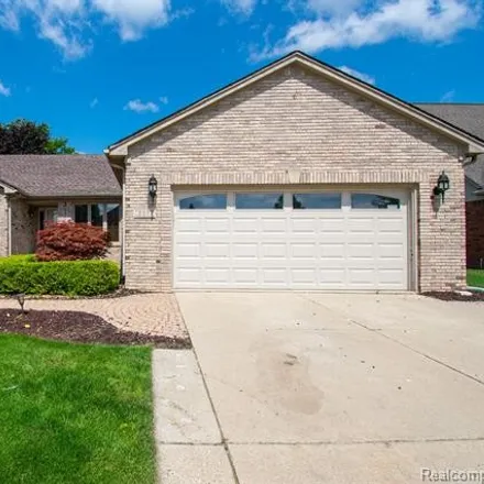 Buy this 3 bed house on 15869 Gardenia Court in Macomb Township, MI 48042