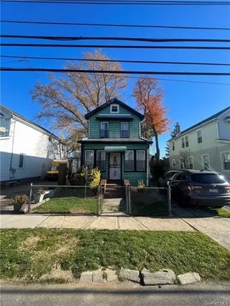 Buy this 3 bed house on 118-27 219th Street in New York, NY 11411