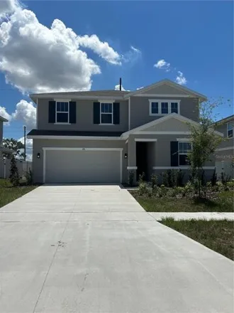 Rent this 4 bed house on 236 Hilltop Bloom Loop in Haines City, Florida