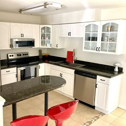 Rent this 3 bed house on 682 Avenida Hermosa in West Palm Beach, FL 33405