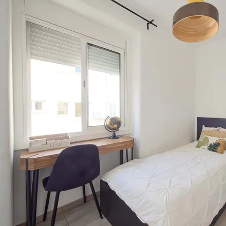 Rent this 6 bed room on Avenida São João de Deus in 1000-009 Lisbon, Portugal