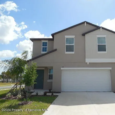 Rent this 4 bed house on Lily Avenue in Spring Hill, FL 34909
