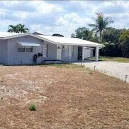 Rent this 3 bed house on 8253 Southeast Boxwood Lane in Martin County, FL 33455