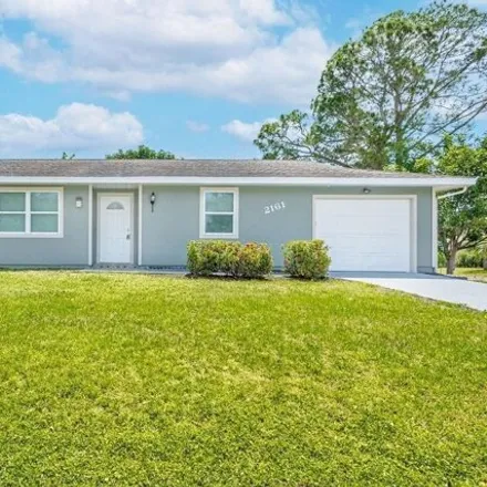 Buy this 3 bed house on 2161 Se Airoso Blvd in Port Saint Lucie, Florida