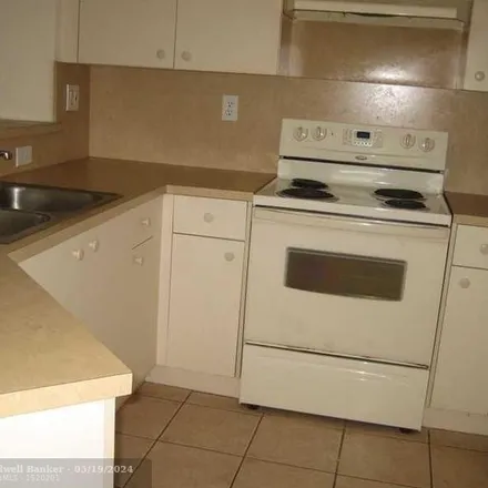 Rent this 2 bed townhouse on 10584 Southgate Boulevard in Tamarac, FL 33321