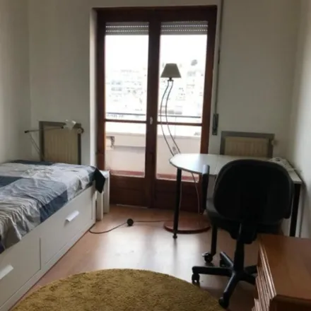 Rent this 4 bed room on Rua do Arco do Chafariz das Terras in 1249-024 Lisbon, Portugal