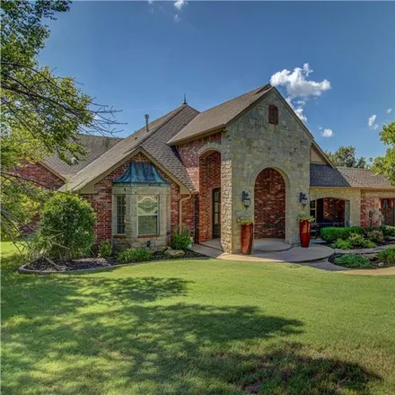 Buy this 4 bed house on 2470 Redbud Canyon Drive in Edmond, OK 73034