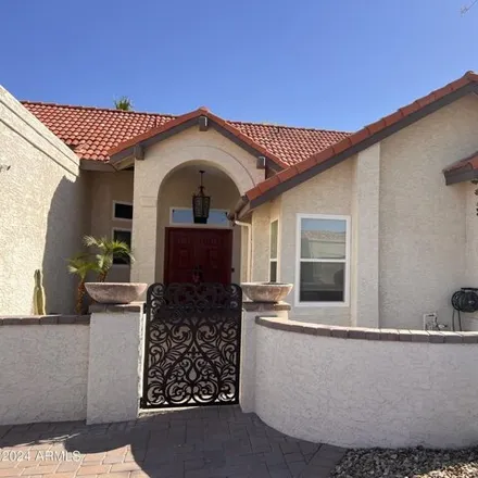 Rent this 4 bed house on 3846 East White Aster Street in Phoenix, AZ 85044