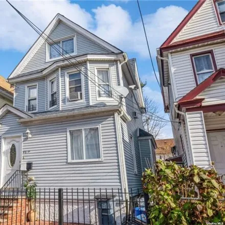 Buy this 4 bed house on 86-31 131st Street in New York, NY 11418
