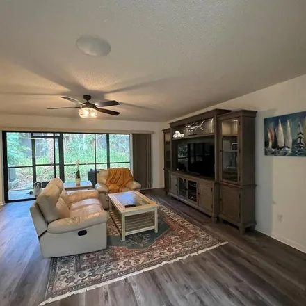 Rent this 3 bed apartment on 1861 Whispering Way in Tarpon Springs, FL 34689