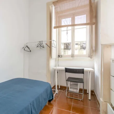 Rent this 4 bed room on Tapa Bucho in Rua dos Mouros 19, 1200-385 Lisbon