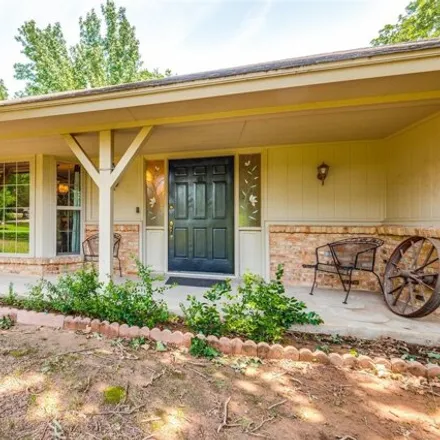 Buy this 3 bed house on Hidden Oaks Lane in Arlington, TX 76017