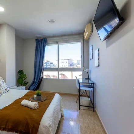 Rent this 9 bed room on Rosa Clará in Carrer de Xàtiva, 46002 Valencia