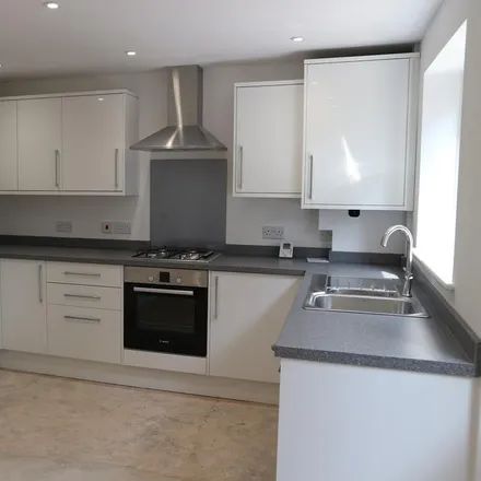 Rent this 3 bed townhouse on Katherine Chance Close in Burton, BH23 7LU