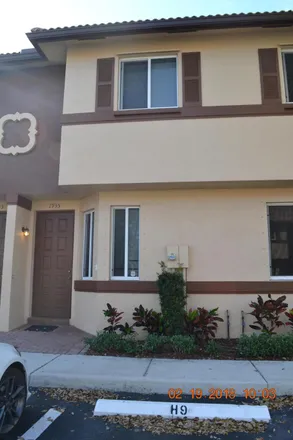 Rent this 2 bed townhouse on 1935 Hibiscus Lane in Riviera Beach, FL 33404