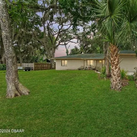 Buy this 3 bed house on 3410 Mango Tree Drive in Edgewater, FL 32141