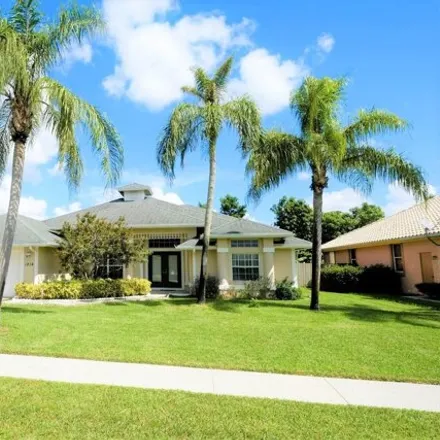 Rent this 4 bed house on 1810 Wisteria Street in Wellington, FL 33414