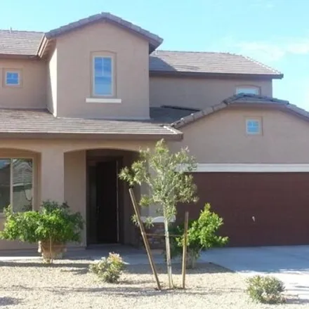 Rent this 4 bed house on 16143 West Desert Flower Drive in Goodyear, AZ 85395