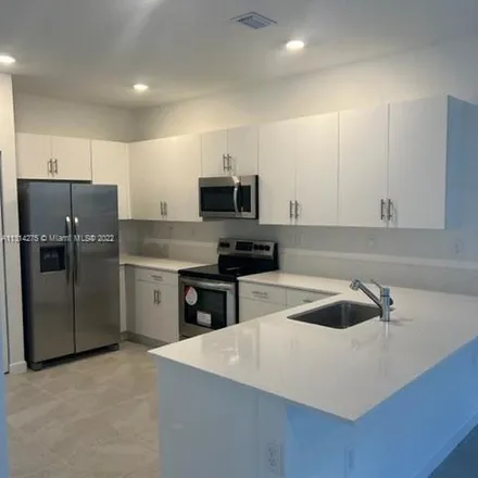 Rent this 4 bed apartment on Southeast 11th Street in Homestead, FL 33035