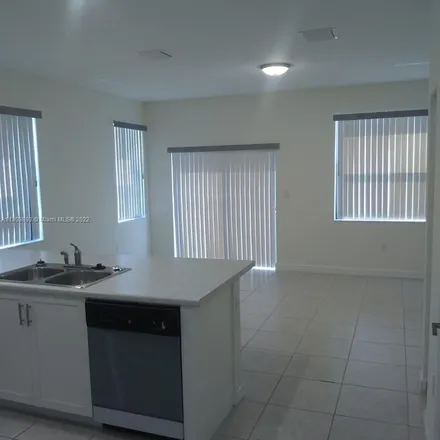 Rent this 3 bed apartment on West 32nd Lane in Hialeah, FL 33018