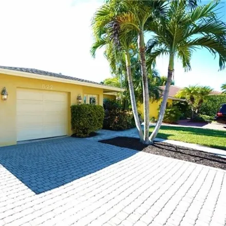 Rent this 3 bed house on 572 105th Ave N in Naples, Florida