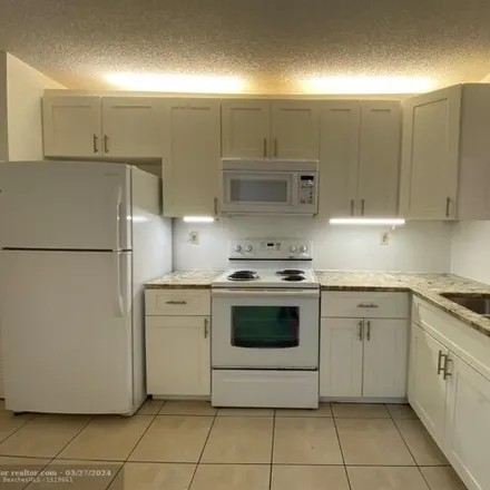 Rent this 2 bed condo on Northwest 28th Drive in Coral Springs, FL 33065