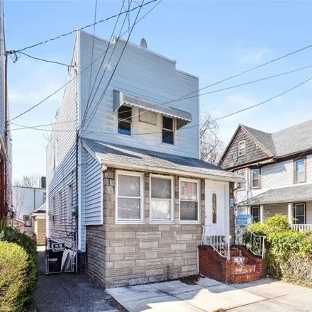 Buy this 3 bed house on 91-24 80th Street in New York, NY 11421