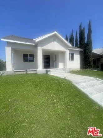 Rent this 4 bed house on 1275 South Lucerne Boulevard in Los Angeles, CA 90019