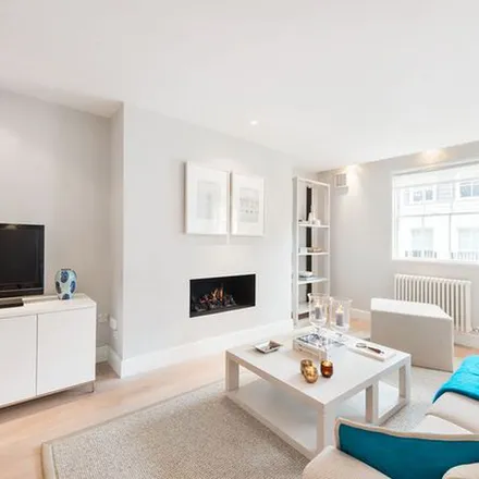 Rent this 4 bed townhouse on The White House in 4 Hans Crescent, London