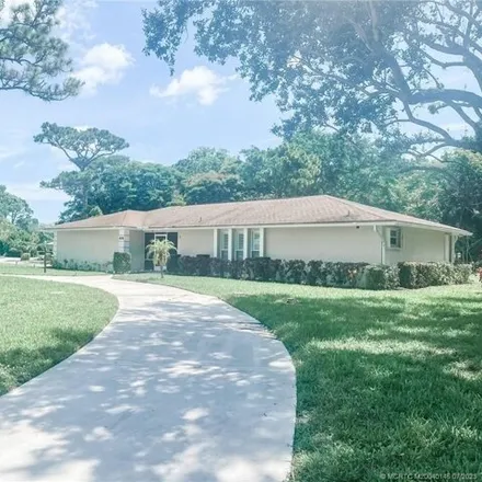 Rent this 4 bed house on 3063 Northeast Pinecrest Lakes Boulevard in Jensen Beach, FL 34957