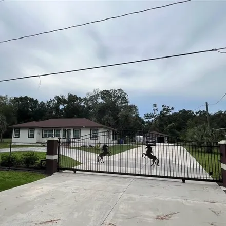 Buy this 4 bed house on 7127 32nd Avenue South in Clair-Mel City, FL 33619