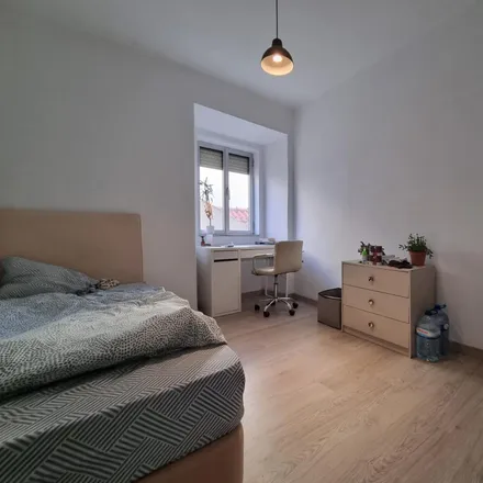 Rent this 5 bed room on Rua de Alcântara in 1300-611 Lisbon, Portugal