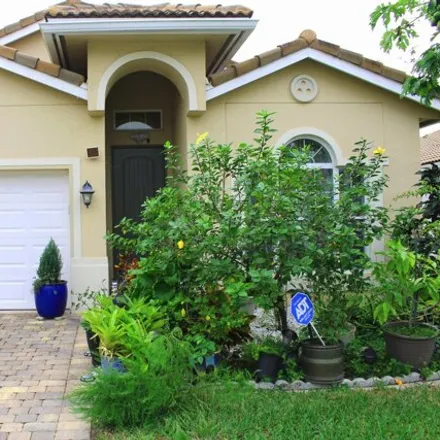 Buy this 3 bed house on 5676 Caranday Palm Drive in Greenacres, FL 33463