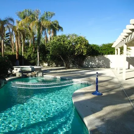 Rent this 4 bed house on 99 Sutton Place East in Palm Desert, CA 92211