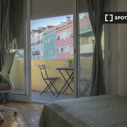 Rent this 4 bed room on Rua Carvalho Araújo 51 in 1900-140 Lisbon, Portugal