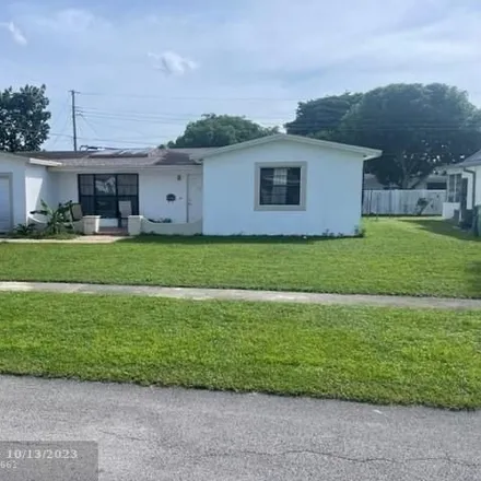 Rent this 4 bed house on 4424 Northwest 22nd Street in Lauderhill, FL 33313
