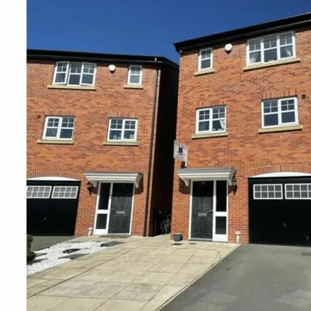 Buy this 4 bed townhouse on Gardeners Close in Lancs, Lancashire