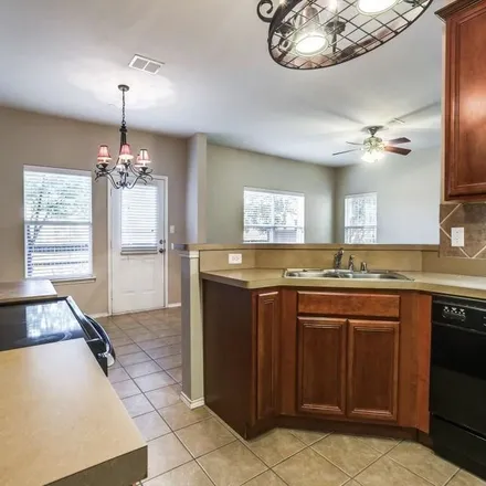 Rent this 3 bed townhouse on 4529 Woodsboro Lane in Plano, TX 75024