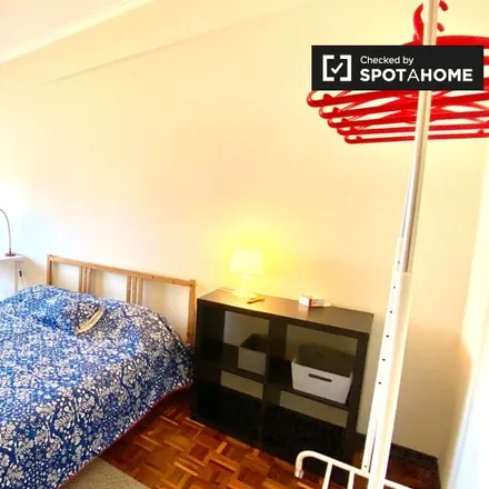 Rent this 4 bed room on Rua André de Gouveia in 1600-038 Lisbon, Portugal