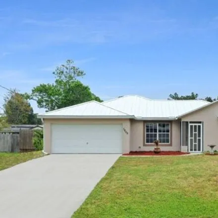 Buy this 3 bed house on 1299 Savannah Street in Indian River Estates, Saint Lucie County