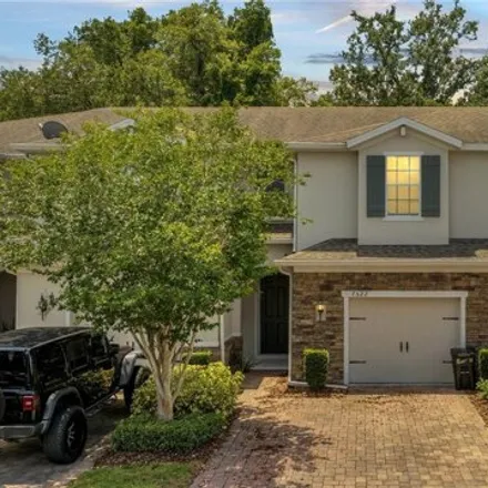 Buy this 3 bed townhouse on 7526 Aloma Pines Ct in Winter Park, Florida