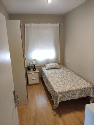 Rent this 3 bed room on Calle de Almonacid in 28, 28038 Madrid
