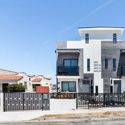 Rent this 4 bed townhouse on 4635 Saint Charles Place in Los Angeles, CA 90019