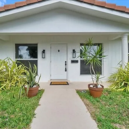 Rent this 4 bed house on 5873 Northeast 20th Terrace in Imperial Point, Fort Lauderdale